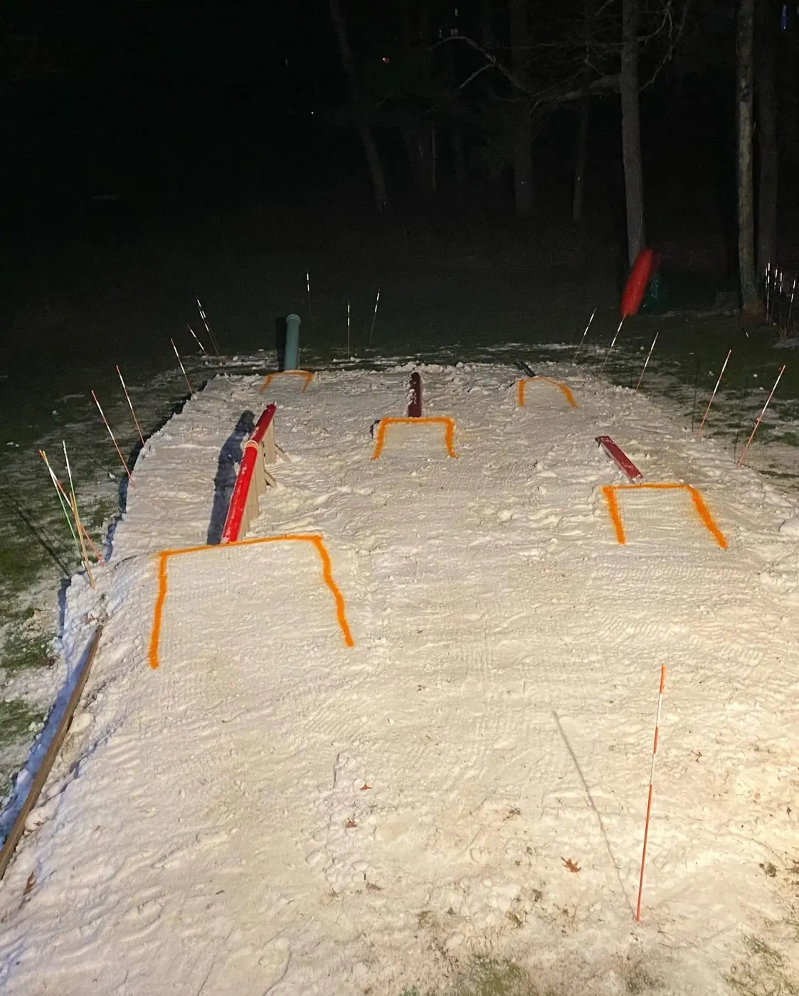 A park at night with features outlined in orange.