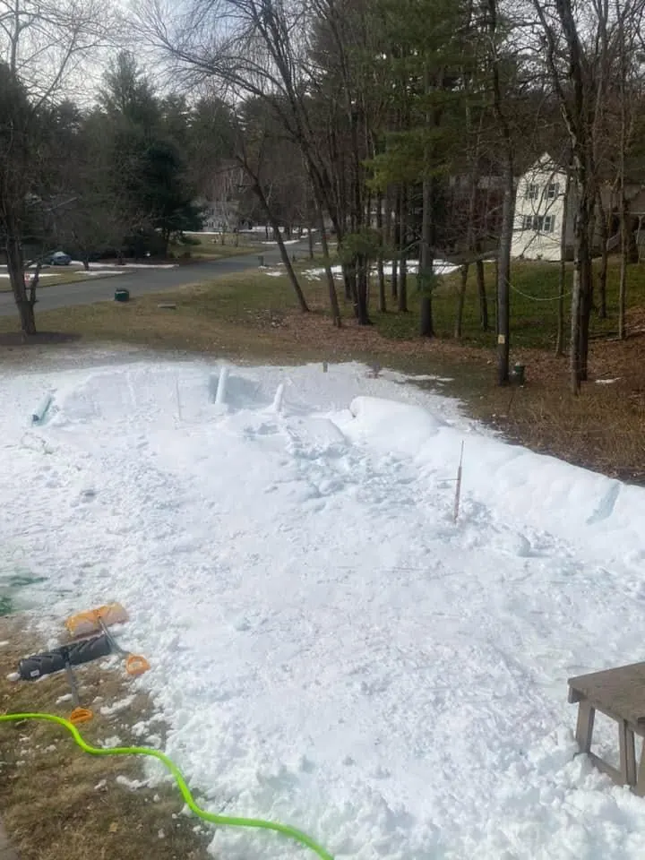 A fresh strip of made snow next to the yard.