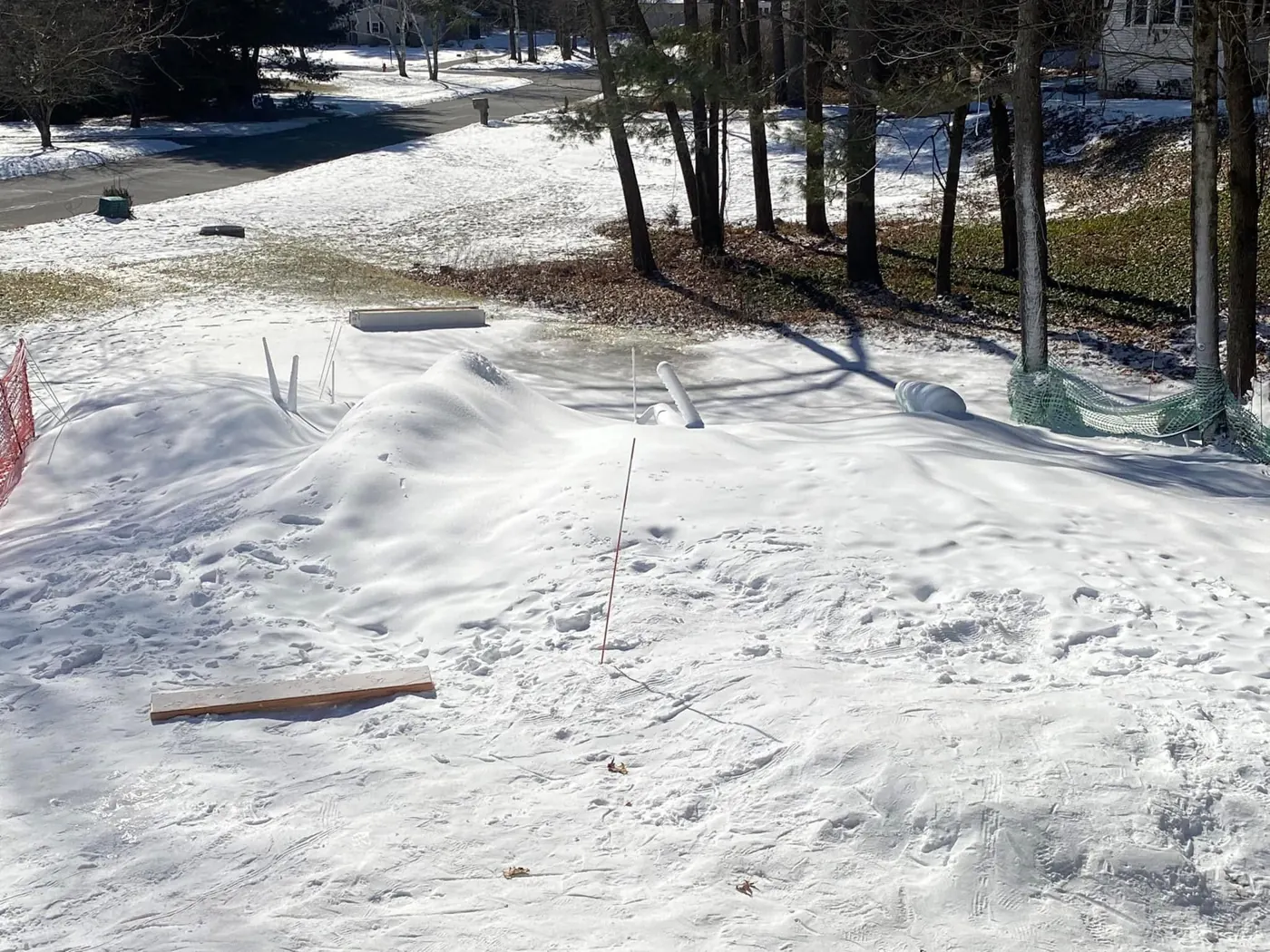 Made snow covering a sloped yard.