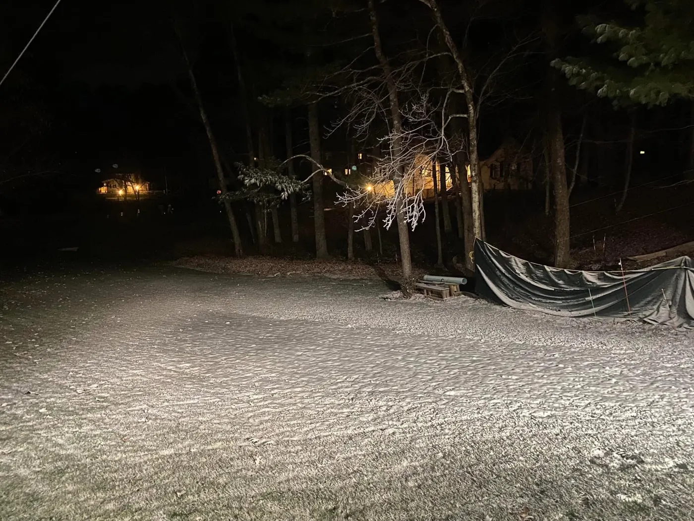 Made snow covering the yard at night.